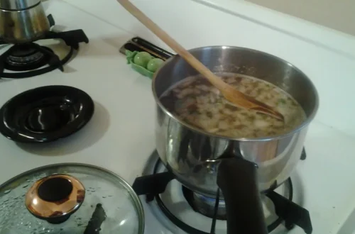 Dried beans soaking and cooking in water in a pot — how to cook dried beans at home