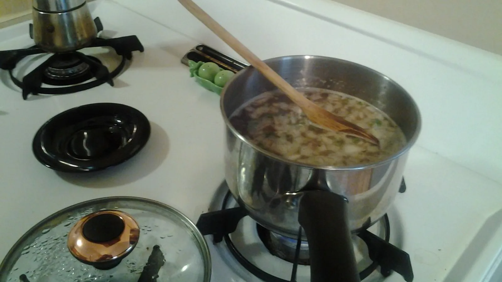 Dried beans soaking and cooking in water in a pot — how to cook dried beans at home